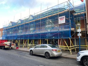 Scaffolding structure installed on a roadside building in Birmingham.